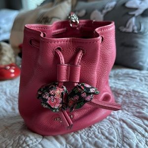 Coach pink pouch wristlet w/floral accents